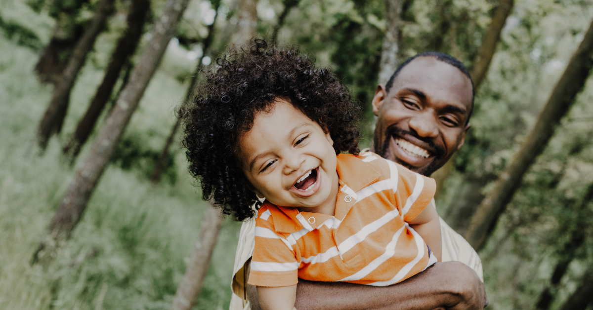 black father with child.