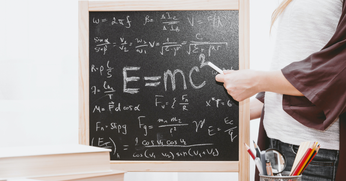Student solving a math problem at the chalk board. Photo by JESHOOTS.COM on Unsplash